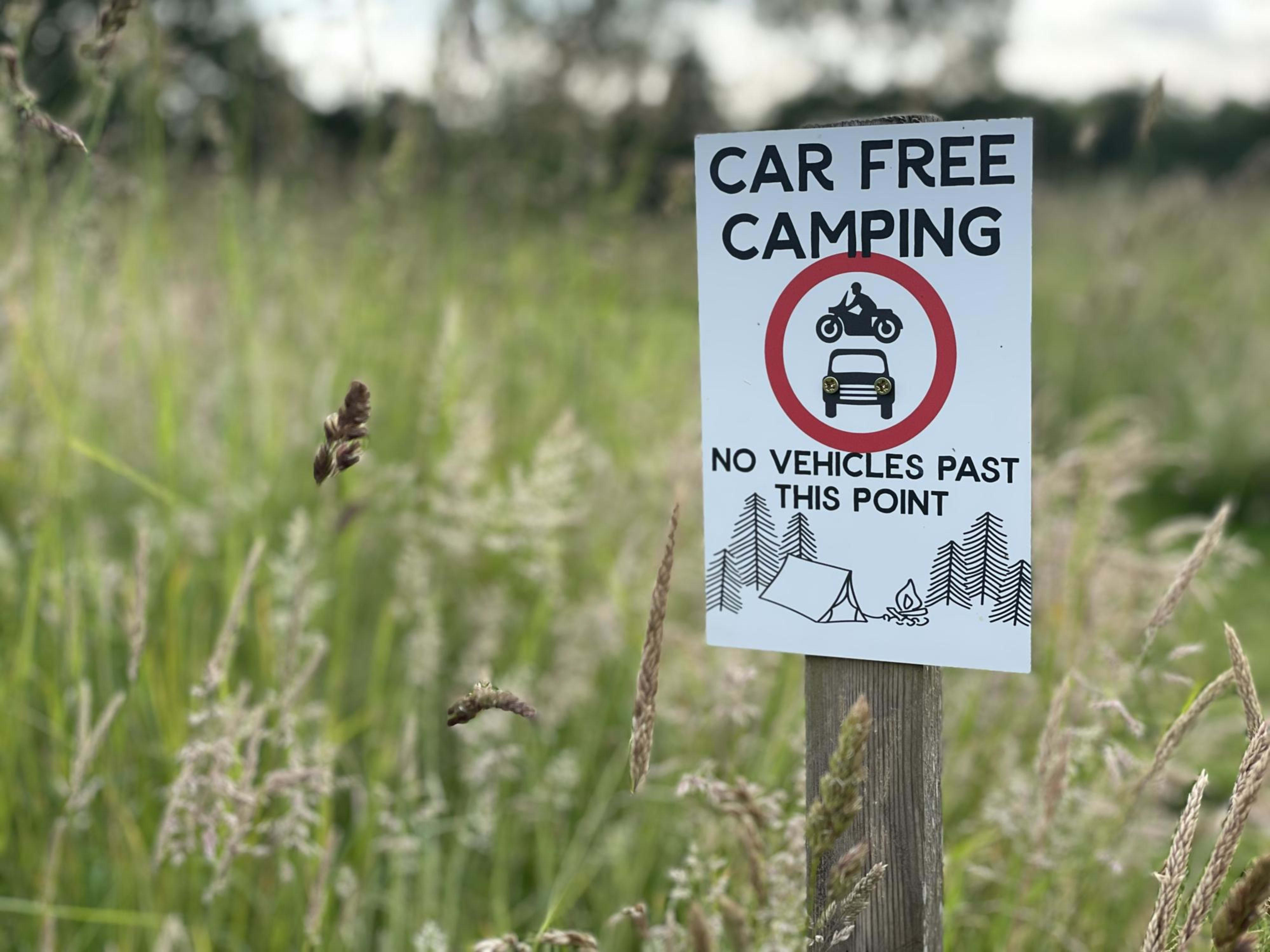 Car Free Camping sign on a campsite in Norfolk